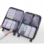 Un set de almacenamiento de viaje de gran capacidad, 7 piezas, bolsa para ropa, vaso de embalaje y bolsas de almacenamiento de nailon, adecuado para ropa, pantalones, zapatos, calcetines - una bolsa ligera estilo vacaciones, un regalo ideal para viajeros.