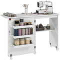 Mesa de costura plegable HOMCOM con tablón abatible, contenedores de almacenamiento, estante abierto y ruedas, gabinete para máquina de coser para sala de estar, oficina, estudio, dimensiones 118 x 40 x 79.5 cm, blanca