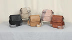 Un nuevo bolso bandolera para mujer con varios bolsillos, tapa abatible, correa ancha de PU tejido de moda y diseñado para llevar sobre un solo hombro