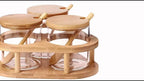 Almacén local, juego de tres tarros para condimentos con soportes triangulares. Tarros de cristal transparente para condimentos con cuchara de bambú y tapa de bambú. 280 ml × 3, aptos para sal, azúcar, especias, pimienta, tarros de condimentos de cocina
