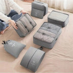 Un set de almacenamiento de viaje de gran capacidad, 7 piezas, bolsa para ropa, vaso de embalaje y bolsas de almacenamiento de nailon, adecuado para ropa, pantalones, zapatos, calcetines - una bolsa ligera estilo vacaciones, un regalo ideal para viajeros.