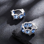 Pendientes de plata 925 de alta calidad para mujer con circonita sintética azul en diseño de corona, perfectos para ocasiones elegantes y a la moda. Regalos ideales para Navidad, San Valentín o cumpleaños, presentados en una hermosa caja de regalo.