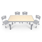 Una mesa acompañada de cuatro sillas, con un diseño de altura ajustable, ideal para una oficina y una mesa de aula que es fácil de limpiar.