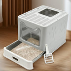 Arenero para gatos de acero inoxidable con entrada frontal y salida superior, diseñado para facilitar la limpieza, ideal para gatos y otras mascotas