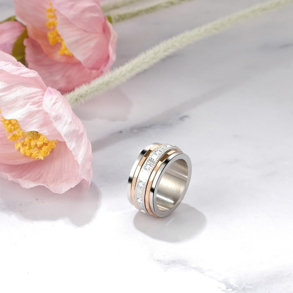 Anillo Giratorio para Ansiedad JewelryWe: Anillo de Acero Inoxidable de 10mm de Ancho con Zirconia Cúbica Sintética, Anillo Antiestrés para Aliviar la Ansiedad, Anillo Giratorio para Pulgar para Mujeres y Hombres, Color Oro Rosa y Plateado