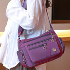 Lingzhikang Bolso Bandolera Unisex Casual - un Bolso de Hombro Espacioso con Múltiples Bolsillos y Correas Ajustables, Hecho de Forro Ligero y Duradero. La Versión Negra Presenta Detalles de Borlas