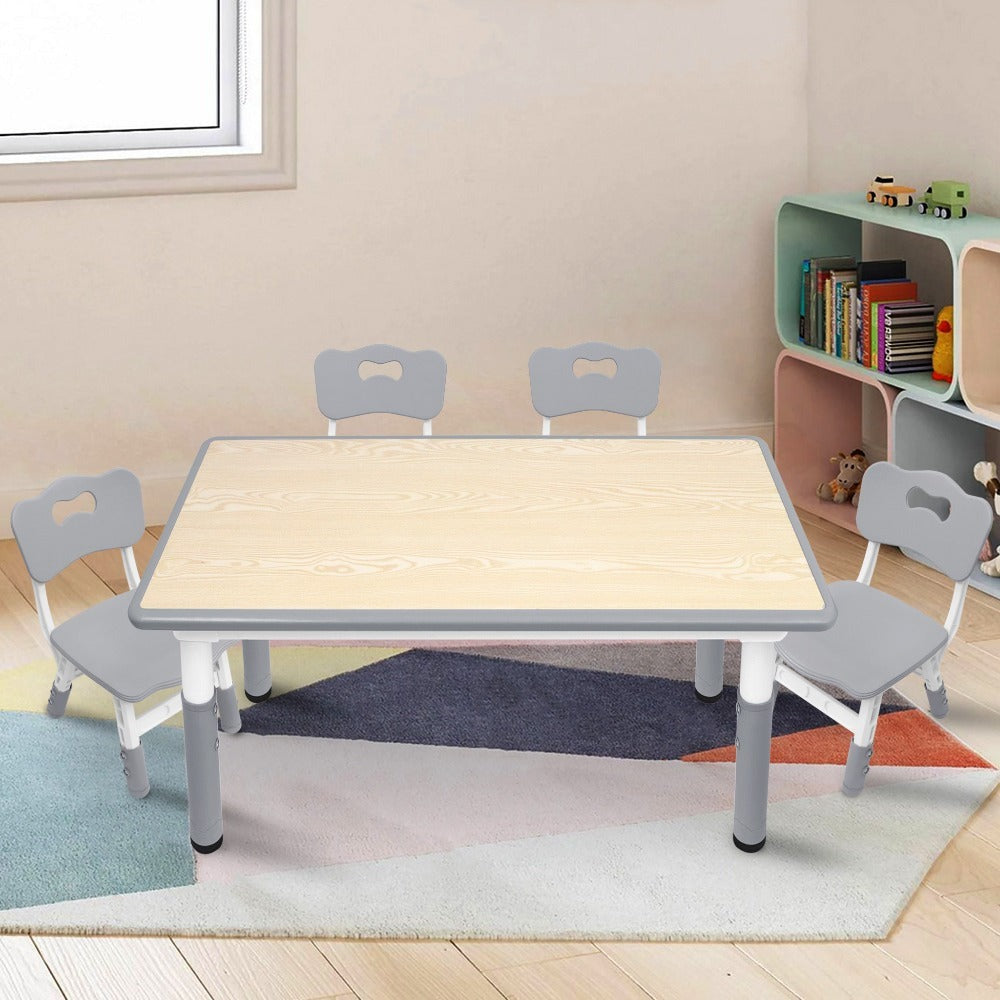 Una mesa acompañada de cuatro sillas, con un diseño de altura ajustable, ideal para una oficina y una mesa de aula que es fácil de limpiar.