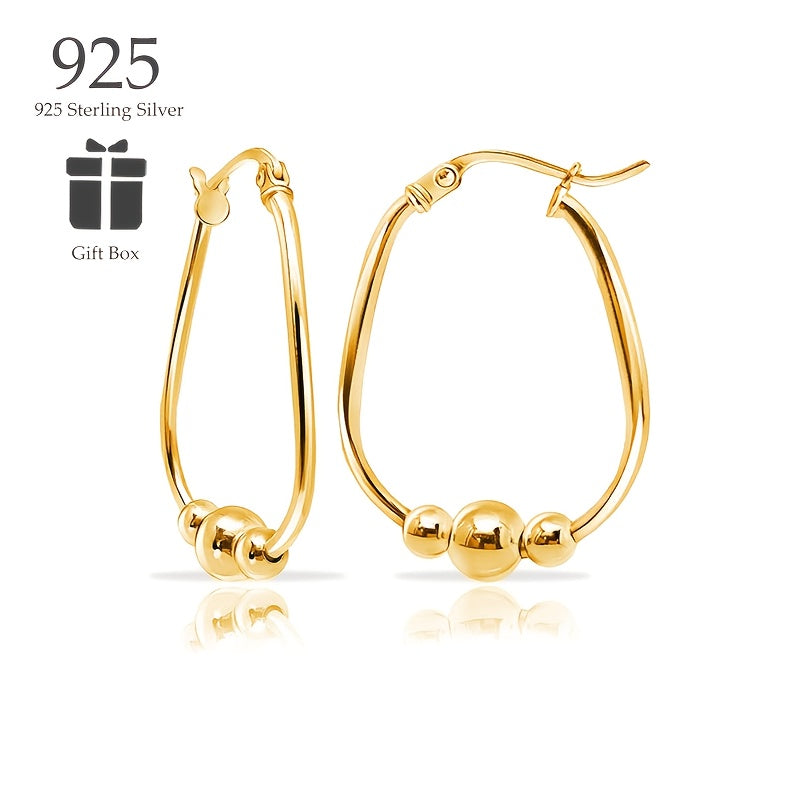 Un set de aretes de aro hechos de plata de ley 925, presentados como un regalo para ella, incluye una caja de regalo