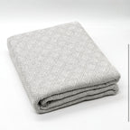 Fular multiusos con tejido Jacquard, resistente y fácil de limpiar, disponible en varios colores y tamaños, ideal para sofá, cama o picnic.