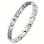 Una elegante y sofisticada pulsera magnética para mujer hecha de titanio, con un imán de 3500 Gauss, tamaño ajustable, y viene con una caja de embalaje y herramienta de ajuste.