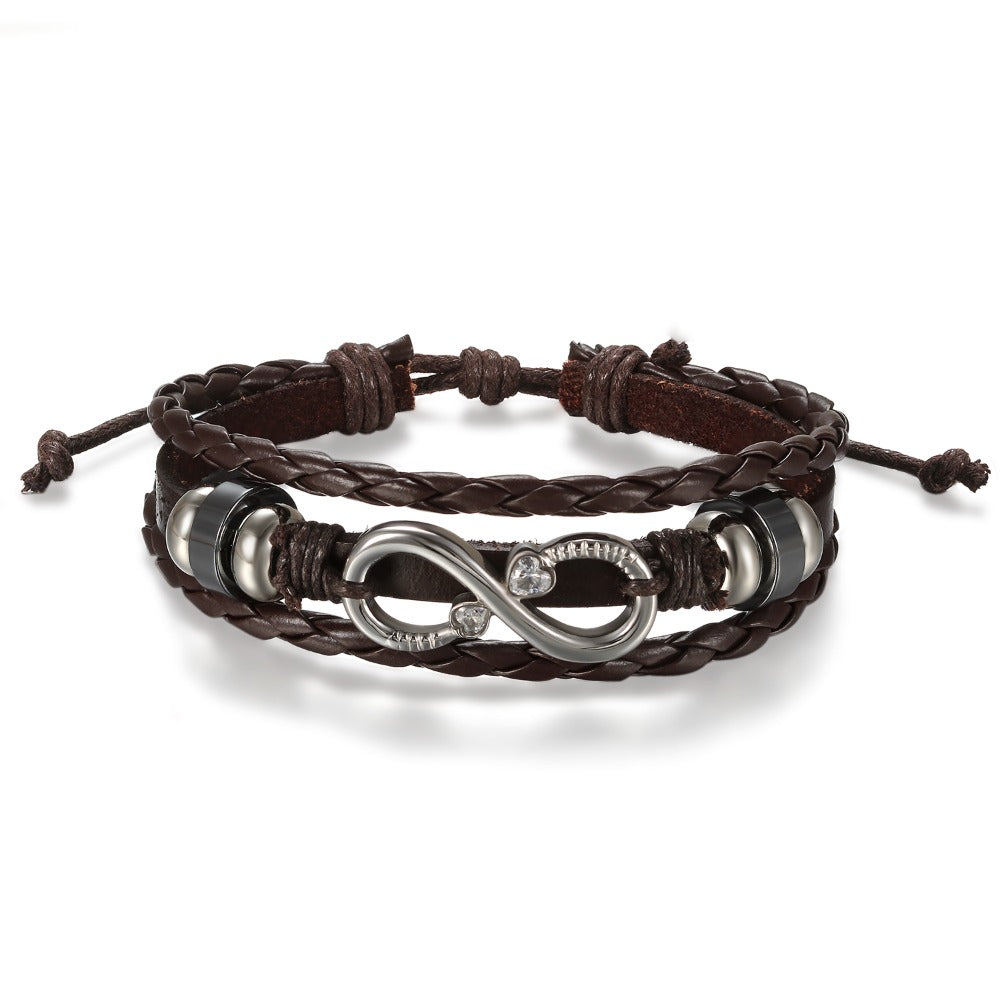 Pulsera de Cuero PU Trenzado con Símbolo Infinito para Hombres y Mujeres - Brazalete en Forma Infinity, Estilo y Blanco Regalo Joyería Unisex Para Boda/Aniversario/Accesorio Punk (Sin Metal, Uso Todo el Año)
