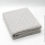 Fular multiusos con tejido Jacquard, resistente y fácil de limpiar, disponible en varios colores y tamaños, ideal para sofá, cama o picnic.