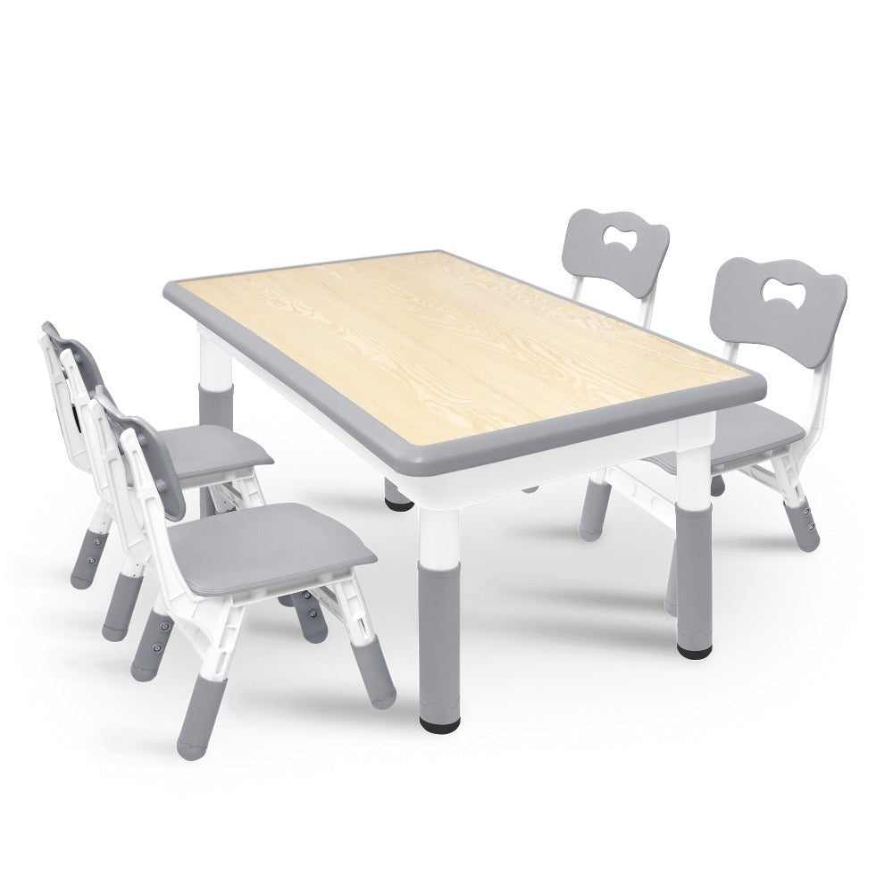 Una mesa acompañada de cuatro sillas, con un diseño de altura ajustable, ideal para una oficina y una mesa de aula que es fácil de limpiar.