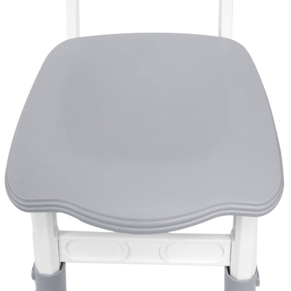 Una mesa acompañada de cuatro sillas, con un diseño de altura ajustable, ideal para una oficina y una mesa de aula que es fácil de limpiar.