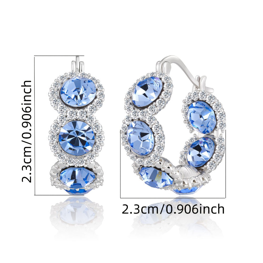 Pendientes de plata 925 de alta calidad para mujer con circonita sintética azul en diseño de corona, perfectos para ocasiones elegantes y a la moda. Regalos ideales para Navidad, San Valentín o cumpleaños, presentados en una hermosa caja de regalo.