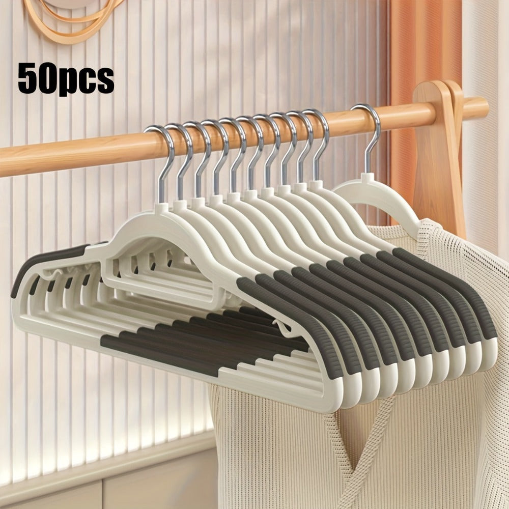 Juego de 50 perchas de plástico diseñadas para evitar que se resbalen, perchero resistente que optimiza el espacio, ideal para organizar prendas, adecuado para armarios, abrigos, camisas y almacenamiento doméstico en dormitorios, armarios y residencias es